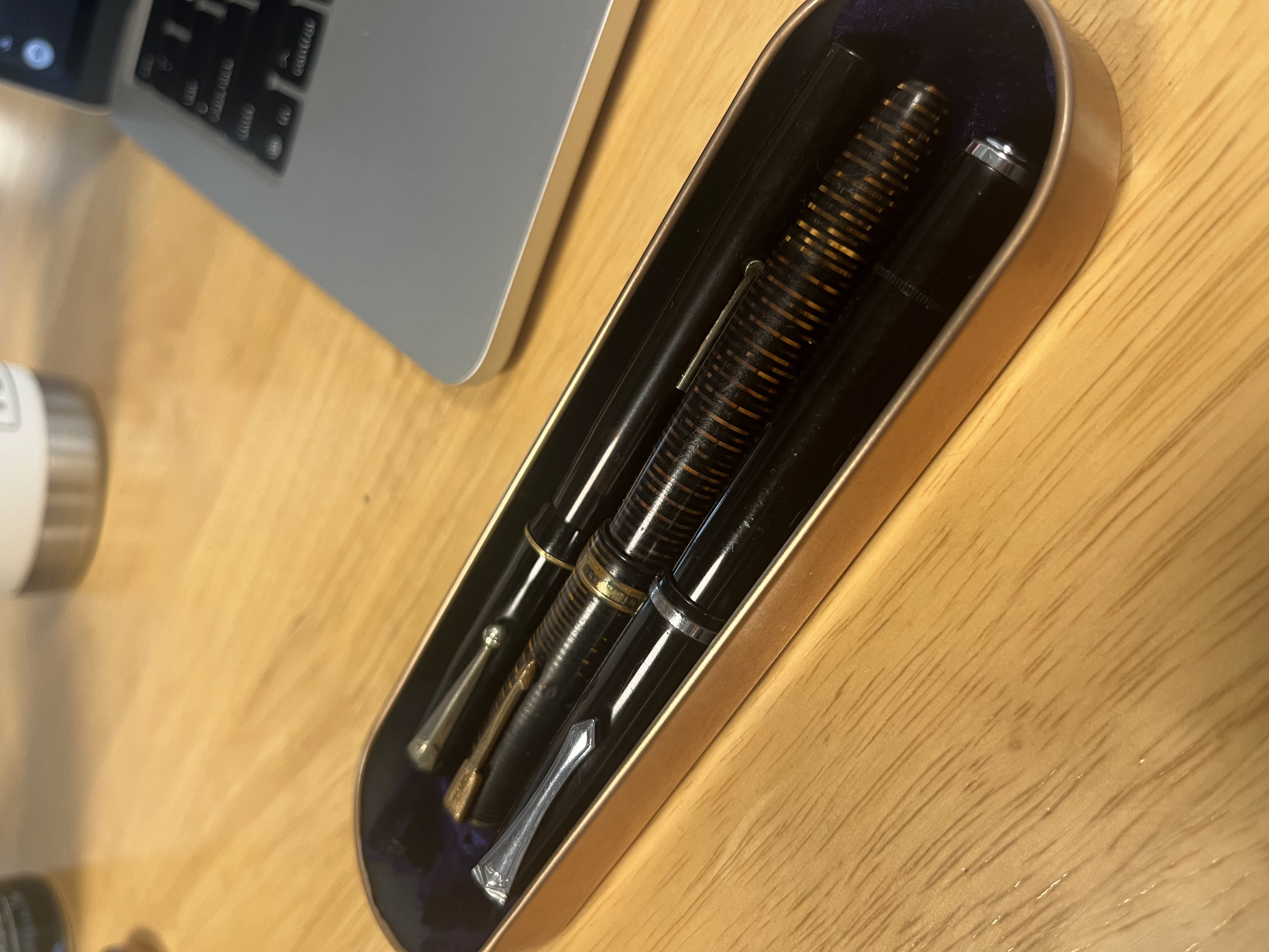 Vintage fountain pens — a Parker Vacumatic, a Pilot eyedropper, and a Swan lever filler